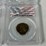 #40221-•-(4)-ground-zero-jamaican-1/2-pennies-graded-image-5