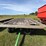 #2456-•-john-deere-1065a-running-gear-hydraulic-dump-flat-rack-image-2