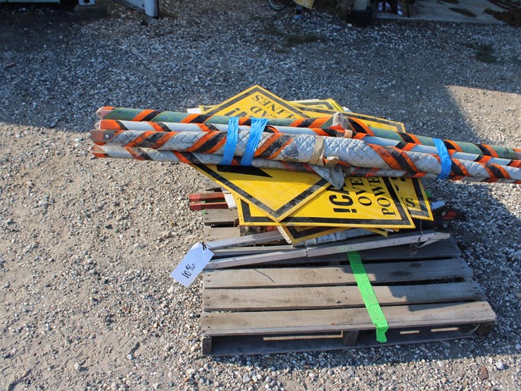 #1046-•-(5)-trucks-entering-and-overfhead-power-line-signs-and-stands-image-1