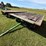 #2456-•-john-deere-1065a-running-gear-hydraulic-dump-flat-rack-image-1