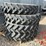(4)-firestone-380/90r46-tires-(80%)-on-12-hole-jd-wheels-image-1