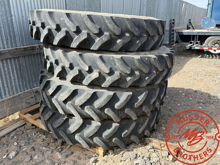(4)-firestone-380/90r46-tires-(80%)-on-12-hole-jd-wheels-image-1