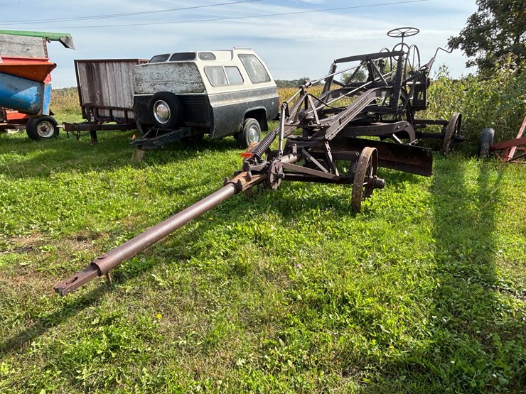 #1329-•-adam-leaning-steel-wheeled-grader-image-1