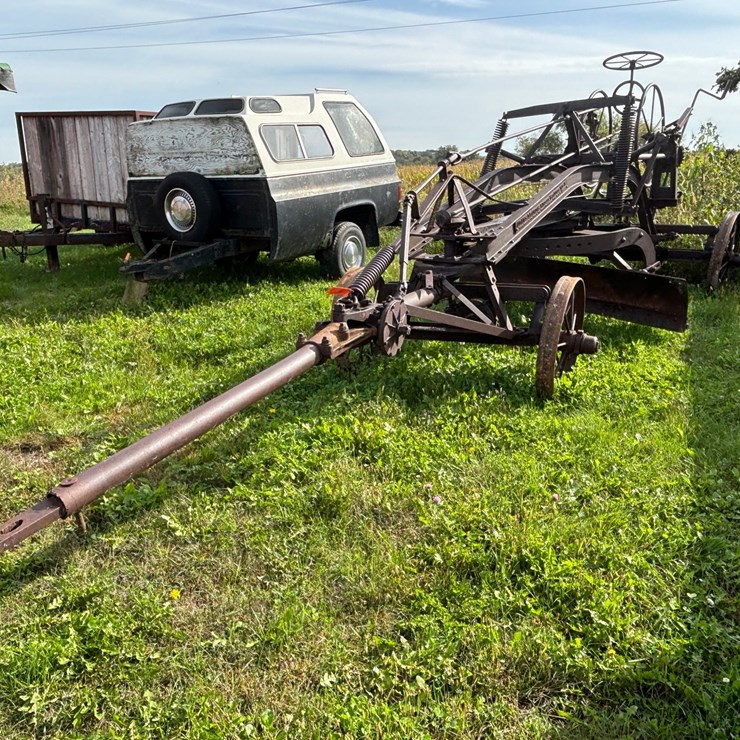 #1329 • Adam Leaning Steel Wheeled Grader