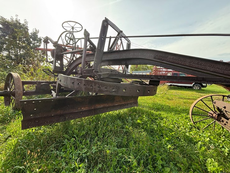 #1329-•-adam-leaning-steel-wheeled-grader-image-16