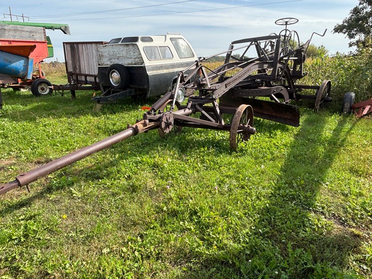 #1329-•-adam-leaning-steel-wheeled-grader-image-2