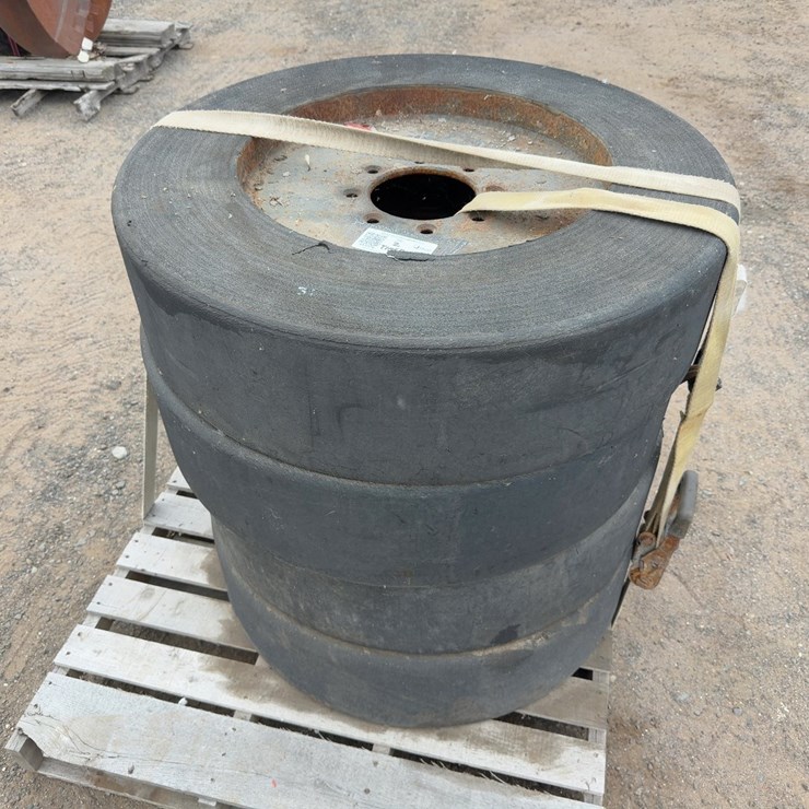 (4) SOLID SKID STEER TIRES