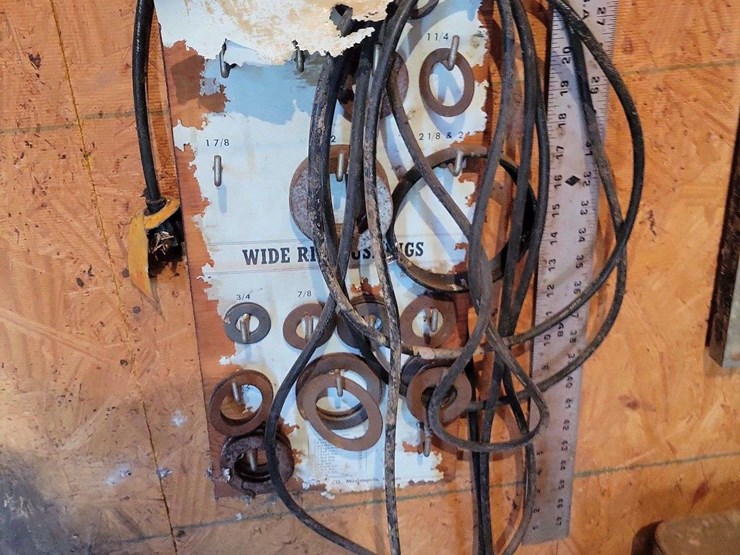 shop-contents-lot-with-metal-workbench,-hand-tools,-automotive-parts,-hardware,-and-signage-image-8