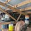 loft-storage-assortment-with-tractor-parts,-furniture,-and-containers-image-6