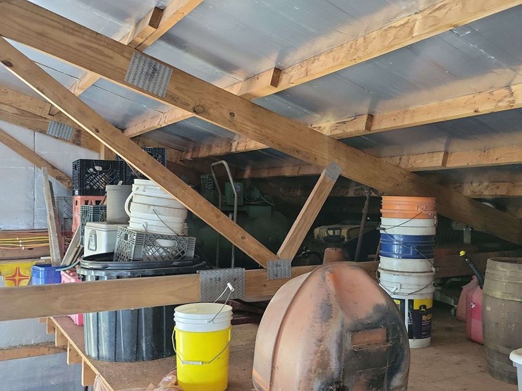 loft-storage-assortment-with-tractor-parts,-furniture,-and-containers-image-6