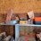 shop-contents-lot-with-metal-workbench,-hand-tools,-automotive-parts,-hardware,-and-signage-image-2