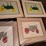 framed-tractor-art-prints,-scale,-watkins-salve-tin,-and-assorted-collectibles-image-3
