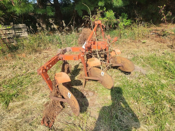 orange-three-bottom-tractor-plow-with-steel-frame-and-moldboards-image-1