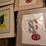 framed-tractor-art-prints,-scale,-watkins-salve-tin,-and-assorted-collectibles-image-2