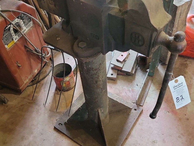 heavy-duty-metal-vise-mounted-on-steel-pedestal-stand-image-1
