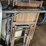 loft-storage-assortment-with-tractor-parts,-furniture,-and-containers-image-8