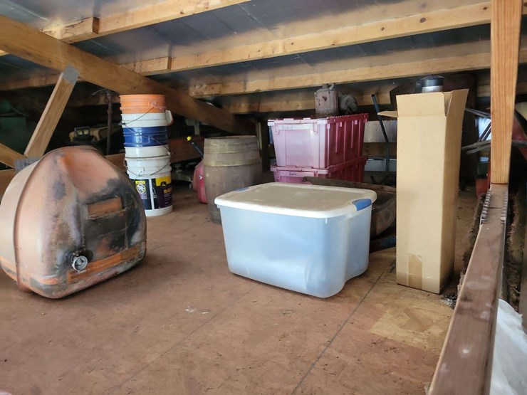 loft-storage-assortment-with-tractor-parts,-furniture,-and-containers-image-5