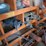 shop-storage-shelving-unit-with-contents-including-tractor-parts,-hoses,-and-hardware-image-3