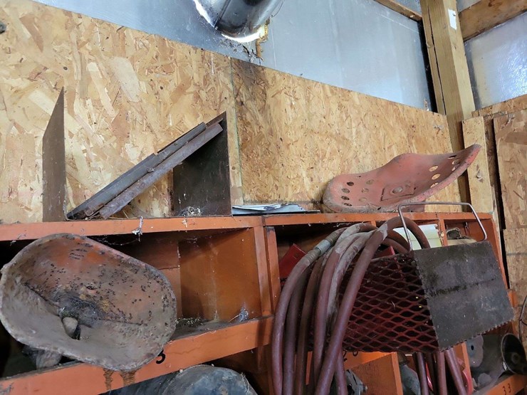 shop-storage-shelving-unit-with-contents-including-tractor-parts,-hoses,-and-hardware-image-6