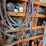 shop-storage-shelving-unit-with-contents-including-tractor-parts,-hoses,-and-hardware-image-5