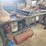 metal-workbenches-with-integrated-storage-and-assorted-automotive-tools-image-1