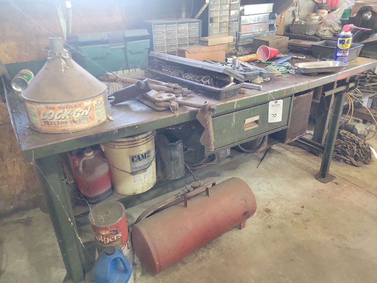 metal-workbenches-with-integrated-storage-and-assorted-automotive-tools-image-1
