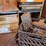 shop-contents-lot-with-metal-workbench,-hand-tools,-automotive-parts,-hardware,-and-signage-image-4