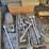 metal-workbenches-with-integrated-storage-and-assorted-automotive-tools-image-3