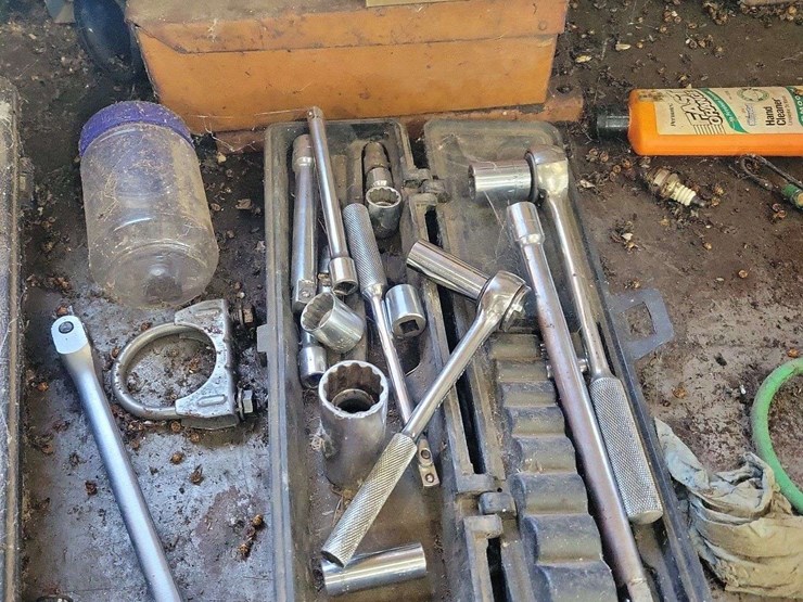 metal-workbenches-with-integrated-storage-and-assorted-automotive-tools-image-3
