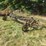 green-farm-cultivator-implement-with-tines-and-gauge-wheels-image-1