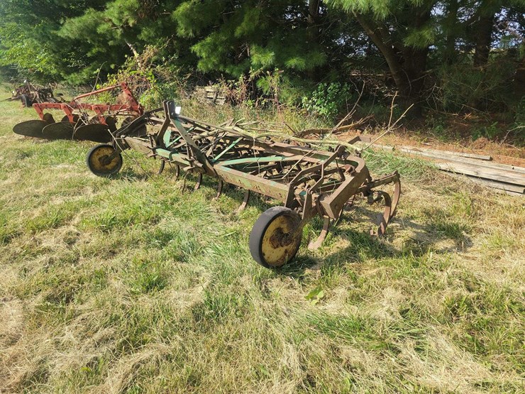 green-farm-cultivator-implement-with-tines-and-gauge-wheels-image-1