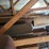 loft-storage-assortment-with-tractor-parts,-furniture,-and-containers-image-10