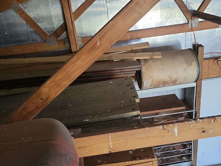 loft-storage-assortment-with-tractor-parts,-furniture,-and-containers-image-10
