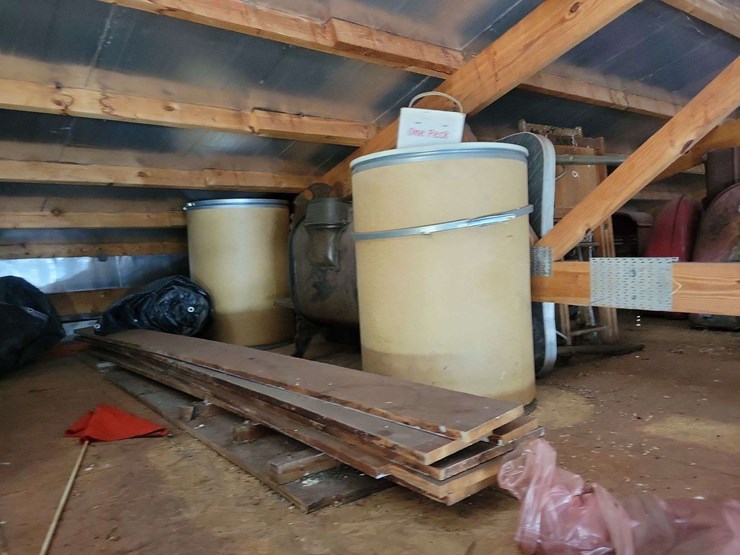 loft-storage-assortment-with-tractor-parts,-furniture,-and-containers-image-3