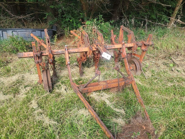 tractor-drawn-multi-row-cultivator-implement-with-metal-frame-and-ground-wheels-image-2