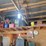 loft-storage-assortment-with-tractor-parts,-furniture,-and-containers-image-2