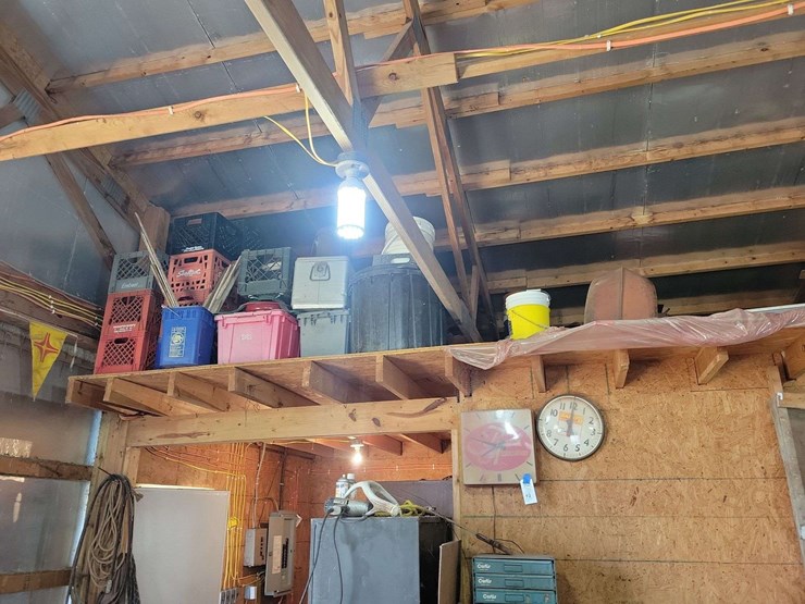 loft-storage-assortment-with-tractor-parts,-furniture,-and-containers-image-2