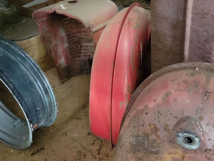 loft-storage-assortment-with-tractor-parts,-furniture,-and-containers-image-9