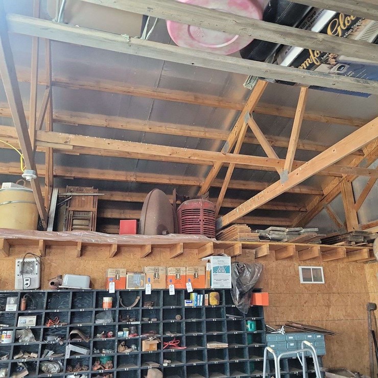 Loft Storage Assortment with Tractor Parts, Furniture, and Containers