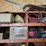 shop-storage-shelving-unit-with-contents-including-tractor-parts,-hoses,-and-hardware-image-2