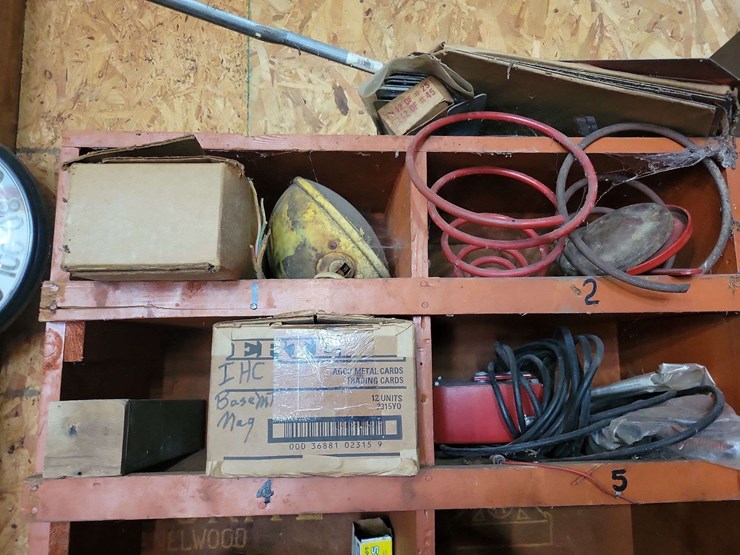 shop-storage-shelving-unit-with-contents-including-tractor-parts,-hoses,-and-hardware-image-2