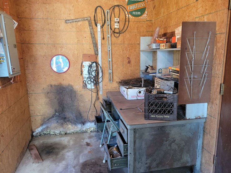shop-contents-lot-with-metal-workbench,-hand-tools,-automotive-parts,-hardware,-and-signage-image-1