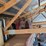 loft-storage-assortment-with-tractor-parts,-furniture,-and-containers-image-4