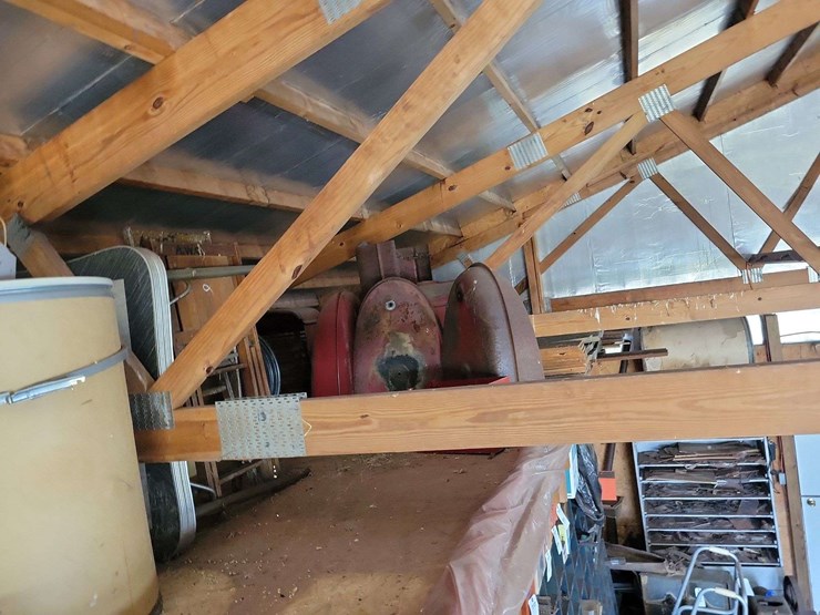 loft-storage-assortment-with-tractor-parts,-furniture,-and-containers-image-4