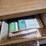 metal-office-desk-with-rolling-chair-and-drawer-contents-image-3