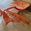 orange-painted-cast-metal-tractor-seat-with-spring-suspension-mount-image-2