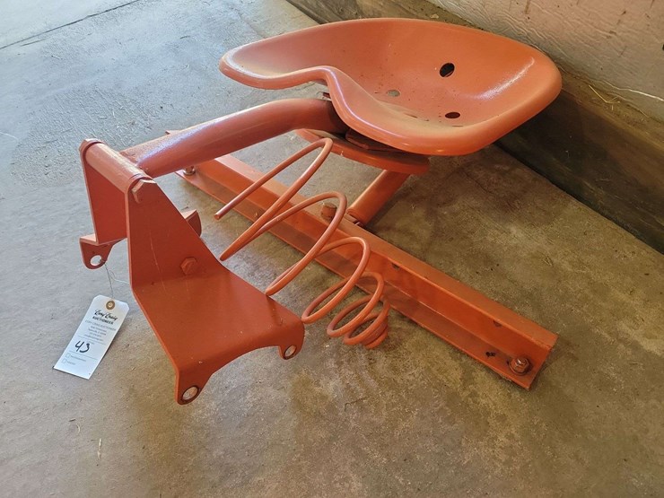 orange-painted-cast-metal-tractor-seat-with-spring-suspension-mount-image-2