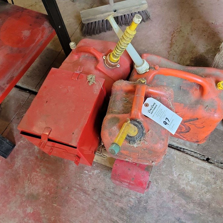 Lot of Red Fuel Cans and Storage Box