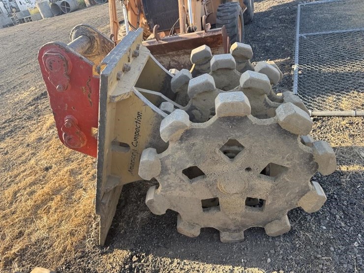 cat-backhoe-compaction-wheel-image-1