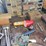 metal-workbenches-with-integrated-storage-and-assorted-automotive-tools-image-4